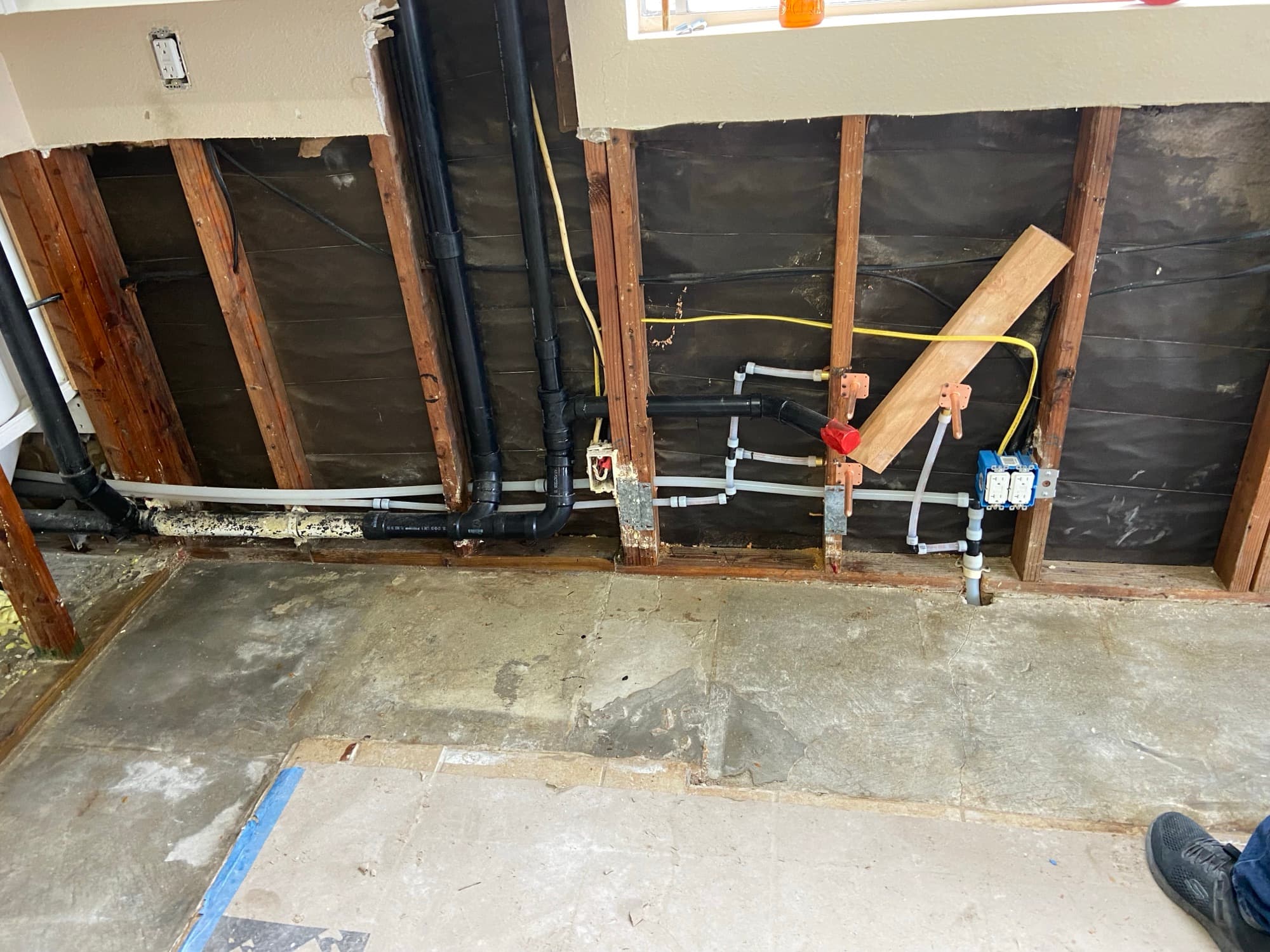 Copper stub-outs and PEX tubing connected to a red-handled shutoff valve, Orange County, CA