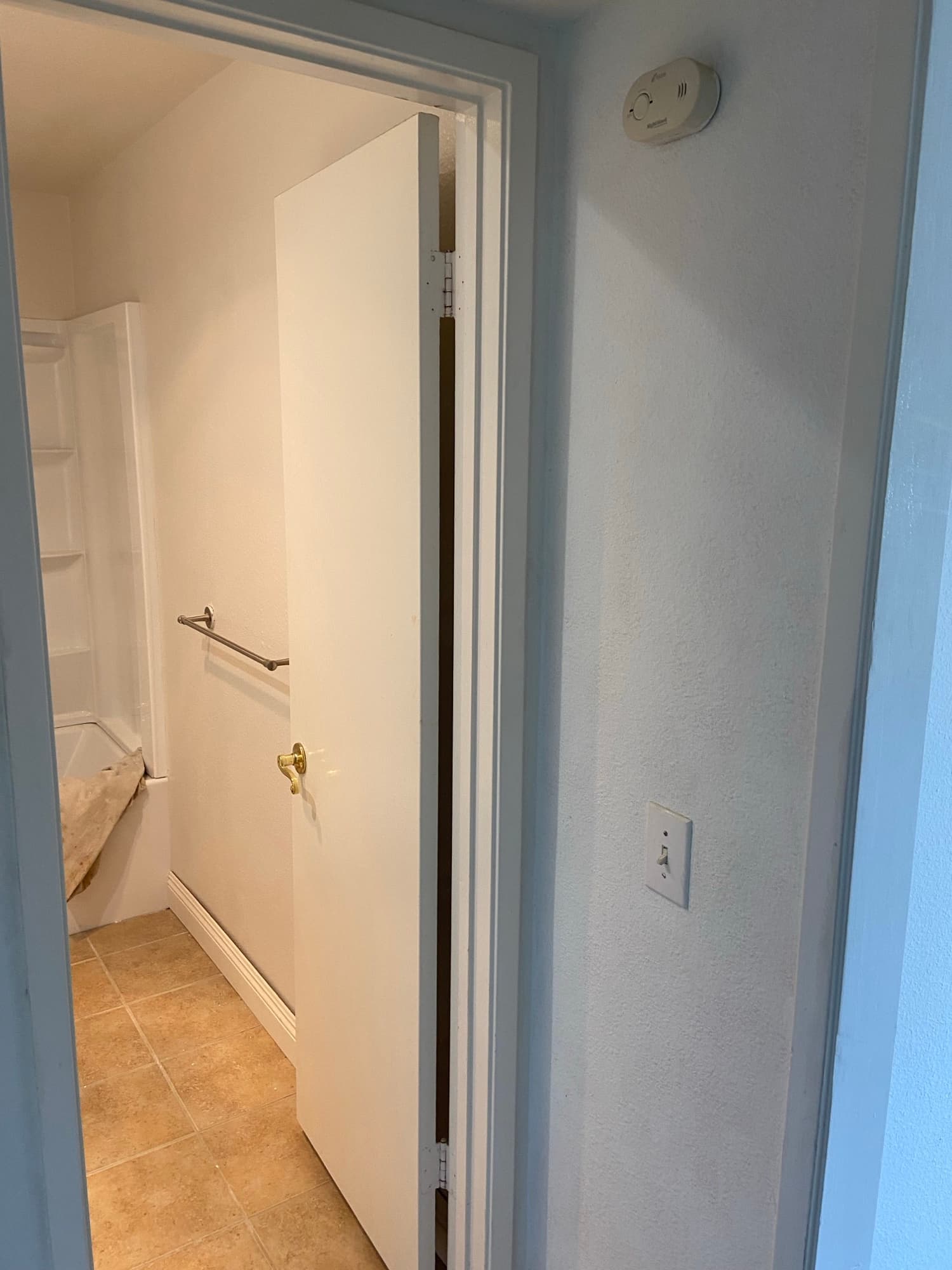 Hallway ceiling near a bathroom doorway after completed renovation work, Orange County, CA