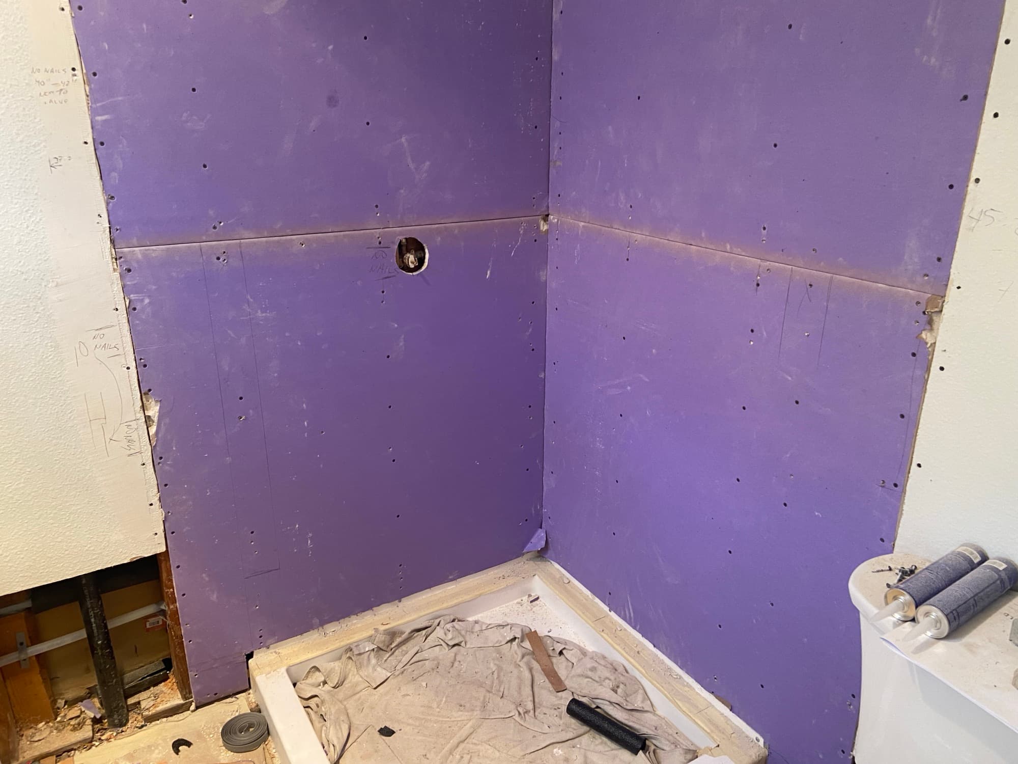 Shower alcove finished with moisture-resistant drywall above the tub, Orange County, CA