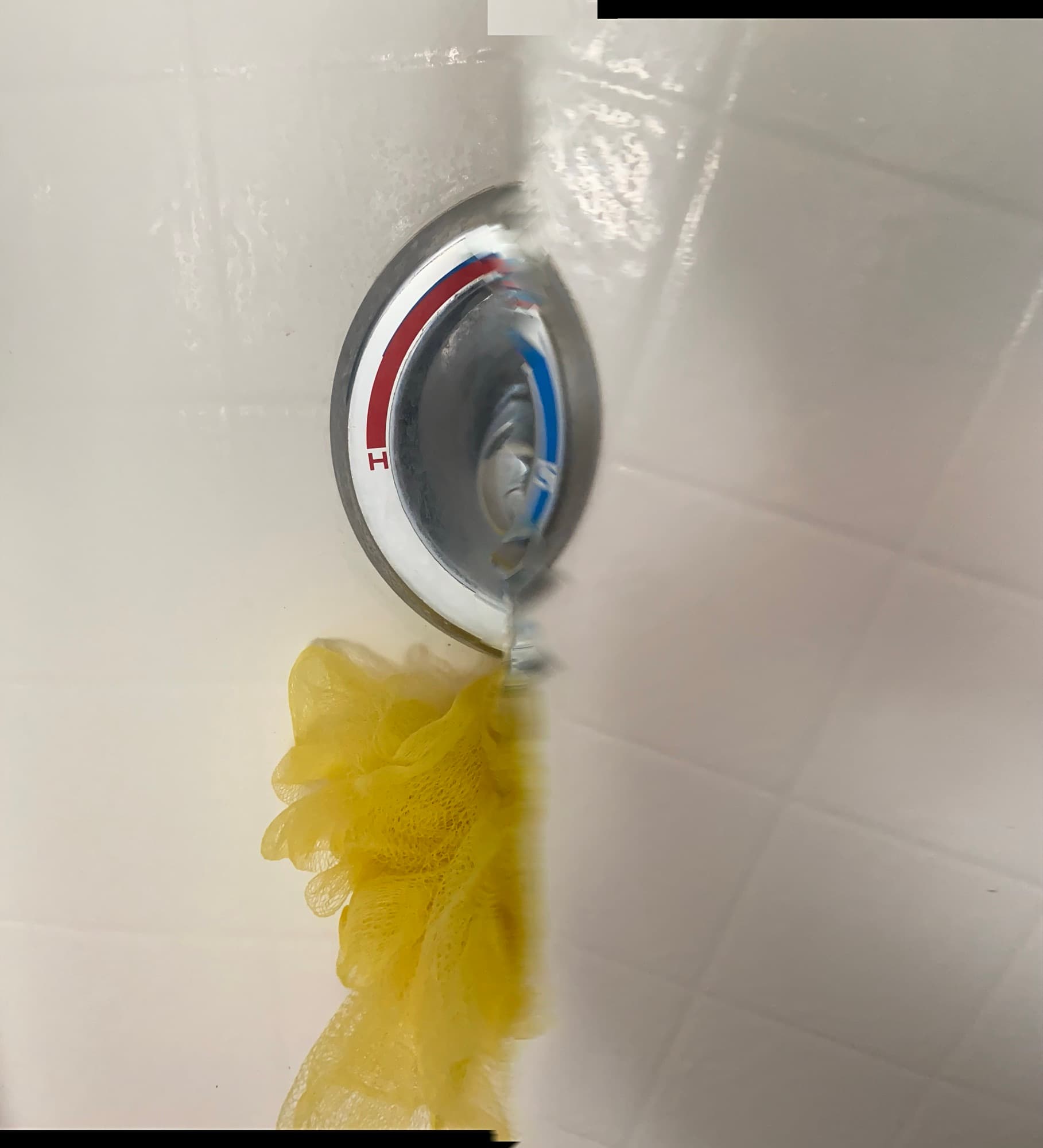 Chrome shower valve trim plate with hot and cold temperature markings, Orange County, CA