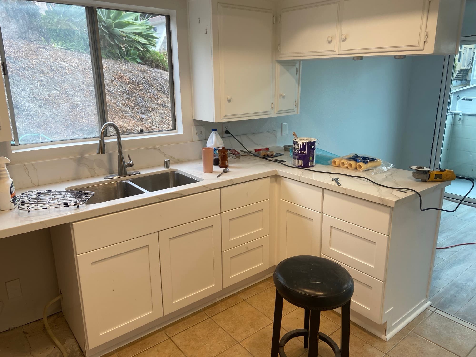 Stainless steel double-basin sink with a gooseneck faucet in a remodeled Orange County, CA kitchen