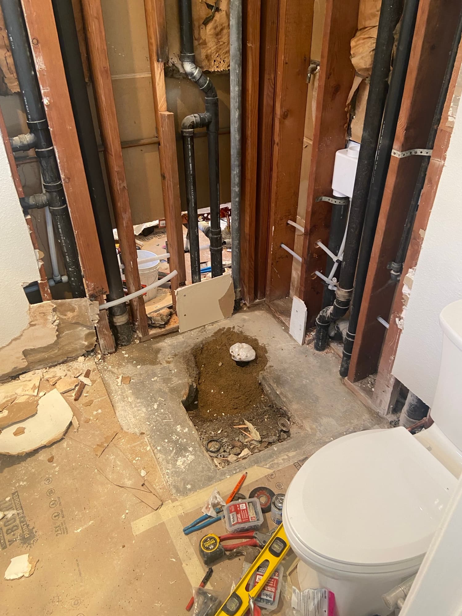 Toilet removed and set aside during an under-slab drain repair, Orange County, CA